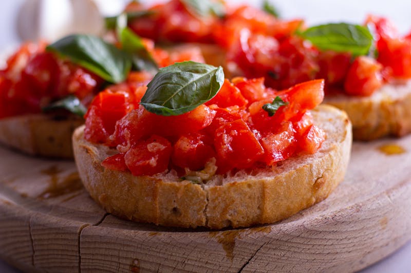 Bruschetta with tomatoes and basil appetizer at Papa Ginos