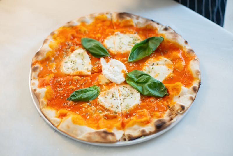 Papa Ginos catering setup at a large event with authentic Italian pizza
